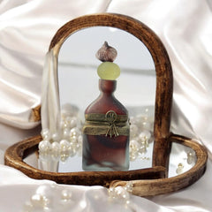 Vintage Romanian art glass perfume bottle with a plum and yellow frosted body, square base, and rounded neck, adorned with bronze wire and a sculptural stopper featuring a translucent yellow-green bead and plum-toned top.