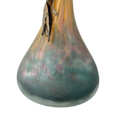 Vintage Romanian art glass vase from the 1990s featuring a frosted teal base, vibrant yellow flared top, and sculptural bronze overlay. Signed by the artist near the base. Elegant and expressive, with subtle surface variation and rich color contrast.