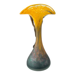 Vintage Romanian art glass vase from the 1990s featuring a frosted teal base, vibrant yellow flared top, and sculptural bronze overlay. Signed by the artist near the base. Elegant and expressive, with subtle surface variation and rich color contrast.
