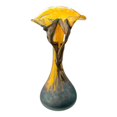 Vintage Romanian art glass vase from the 1990s featuring a frosted teal base, vibrant yellow flared top, and sculptural bronze overlay. Signed by the artist near the base. Elegant and expressive, with subtle surface variation and rich color contrast.