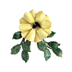 Vintage Sandor yellow enamel flower brooch with green leaves and gold tone accents.