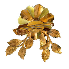 Vintage Sandor yellow enamel flower brooch with green leaves and gold tone accents.