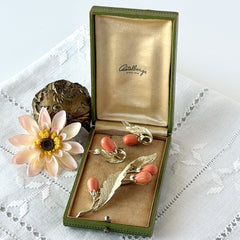 Vintage Sarah Coventry “Bittersweet Berries” brooch and clip‑on earrings set with peach teardrop berries and gold‑tone leaves