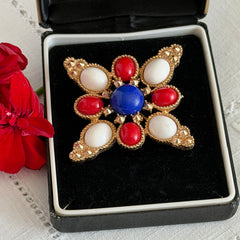 Vintage Sarah Coventry 1972 Americana Maltese cross brooch with red, white and blue cabochons in gold tone