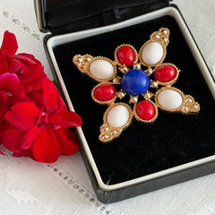 Vintage Sarah Coventry 1972 Americana Maltese cross brooch with red, white and blue cabochons in gold tone