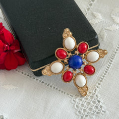 Vintage Sarah Coventry 1972 Americana Maltese cross brooch with red, white and blue cabochons in gold tone