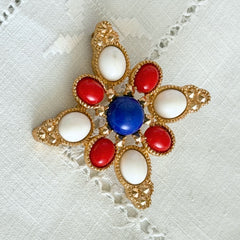 Vintage Sarah Coventry 1972 Americana Maltese cross brooch with red, white and blue cabochons in gold tone
