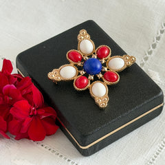 Vintage Sarah Coventry 1972 Americana Maltese cross brooch with red, white and blue cabochons in gold tone