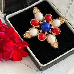 Vintage Sarah Coventry 1972 Americana Maltese cross brooch with red, white and blue cabochons in gold tone