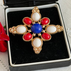 Vintage Sarah Coventry 1972 Americana Maltese cross brooch with red, white and blue cabochons in gold tone