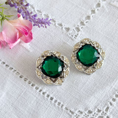 Vintage Sarah Coventry Kathleen emerald and clear rhinestone floral clip‑on earrings, silver‑tone setting.