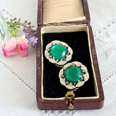 Vintage Sarah Coventry Kathleen emerald and clear rhinestone floral clip‑on earrings, silver‑tone setting.