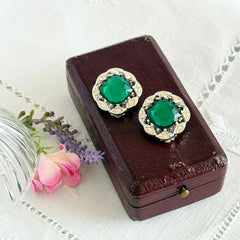 Vintage Sarah Coventry Kathleen emerald and clear rhinestone floral clip‑on earrings, silver‑tone setting.