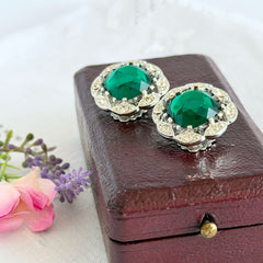 Vintage Sarah Coventry Kathleen emerald and clear rhinestone floral clip‑on earrings, silver‑tone setting.