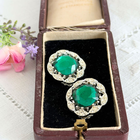 Vintage Sarah Coventry Kathleen emerald and clear rhinestone floral clip‑on earrings, silver‑tone setting.