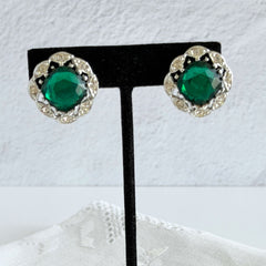 Vintage Sarah Coventry Kathleen emerald and clear rhinestone floral clip‑on earrings, silver‑tone setting.