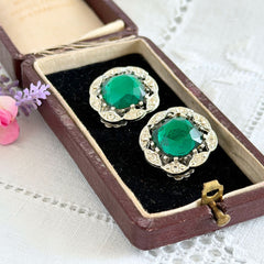 Vintage Sarah Coventry Kathleen emerald and clear rhinestone floral clip‑on earrings, silver‑tone setting.