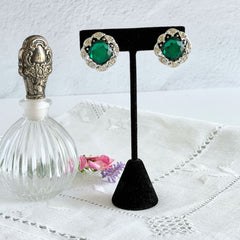 Vintage Sarah Coventry Kathleen emerald and clear rhinestone floral clip‑on earrings, silver‑tone setting.