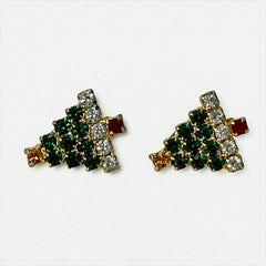 Pair of vintage Sarah Coventry clip-on earrings shaped like Christmas trees, featuring clear and green rhinestones as leaves, a red rhinestone trunk, and a yellow rhinestone star at the top. Gold tone metal with signed clips. Small size, festive design.