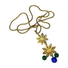 Vintage Shakira Caine Mughal‑style pendant necklace with multicolor glass cabochons, gold tone snake chain, signed and in excellent condition.