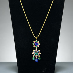Vintage Shakira Caine Mughal‑style pendant necklace with multicolor glass cabochons, gold tone snake chain, signed and in excellent condition.