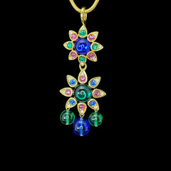 Vintage Shakira Caine Mughal‑style pendant necklace with multicolor glass cabochons, gold tone snake chain, signed and in excellent condition.