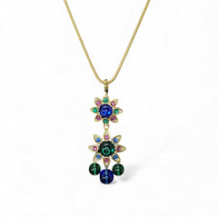 Vintage Shakira Caine Mughal‑style pendant necklace with multicolor glass cabochons, gold tone snake chain, signed and in excellent condition.