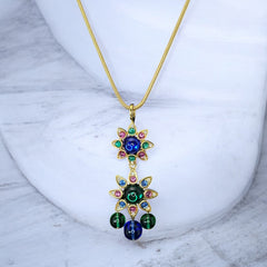 Vintage Shakira Caine Mughal‑style pendant necklace with multicolor glass cabochons, gold tone snake chain, signed and in excellent condition.