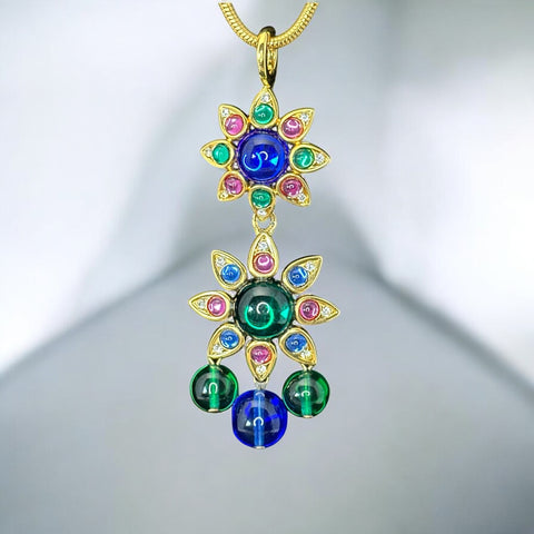Vintage Shakira Caine Mughal‑style pendant necklace with multicolor glass cabochons, gold tone snake chain, signed and in excellent condition.