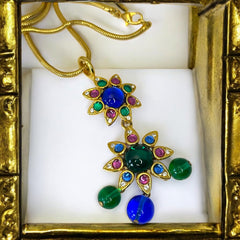 Vintage Shakira Caine Mughal‑style pendant necklace with multicolor glass cabochons, gold tone snake chain, signed and in excellent condition.