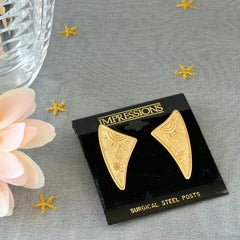Vintage JJ Jonette 1986 gold‑tone sun and star geometric earrings on original card, textured metal, NOS condition.