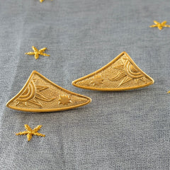 Vintage JJ Jonette 1986 gold‑tone sun and star geometric earrings on original card, textured metal, NOS condition.