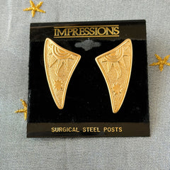 Vintage JJ Jonette 1986 gold‑tone sun and star geometric earrings on original card, textured metal, NOS condition.