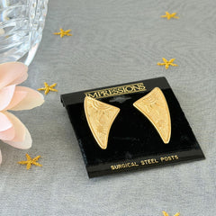 Vintage JJ Jonette 1986 gold‑tone sun and star geometric earrings on original card, textured metal, NOS condition.
