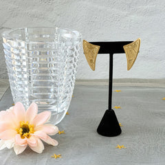 Vintage JJ Jonette 1986 gold‑tone sun and star geometric earrings on original card, textured metal, NOS condition.
