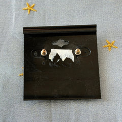 Vintage JJ Jonette 1986 gold‑tone sun and star geometric earrings on original card, textured metal, NOS condition.