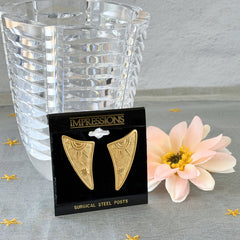 Vintage JJ Jonette 1986 gold‑tone sun and star geometric earrings on original card, textured metal, NOS condition.