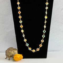 Vintage Swarovski long necklace with bezel‑set AB clear crystal coin stones in gold‑tone metal, signed with Swarovski swan hang tag.