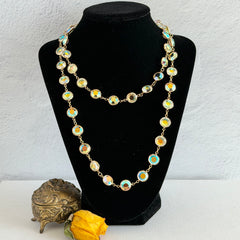 Vintage Swarovski long necklace with bezel‑set AB clear crystal coin stones in gold‑tone metal, signed with Swarovski swan hang tag.