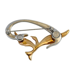 Vintage Swarovski 1999 Freedom Bird brooch with mixed gold‑ and silver‑tone metal and clear pavé crystals, shown from various angles to highlight its sculptural shape and condition.