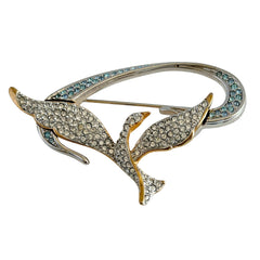 Vintage Swarovski 1999 Freedom Bird brooch with mixed gold‑ and silver‑tone metal and clear pavé crystals, shown from various angles to highlight its sculptural shape and condition.