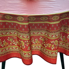 Round coated cotton tablecloth in deep red and golden yellow, featuring ornate Provençal floral and geometric patterns