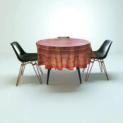 Round coated cotton tablecloth in deep red and golden yellow, featuring ornate Provençal floral and geometric patterns