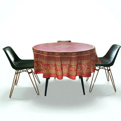 Round coated cotton tablecloth in deep red and golden yellow, featuring ornate Provençal floral and geometric patterns