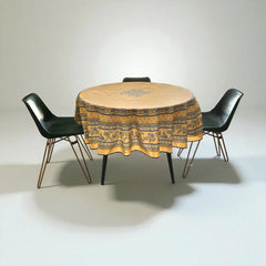 Round coated cotton tablecloth in sunny yellow and deep blue, featuring alternating Provençal floral and geometric bands