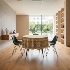 Round coated cotton tablecloth in sunny yellow and deep blue, featuring alternating Provençal floral and geometric bands