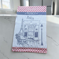 Light blue French tea towel with red gingham borders and a navy illustration of a Paris café and Eiffel Tower, by Coucke.