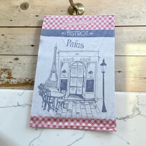 Light blue French tea towel with red gingham borders and a navy illustration of a Paris café and Eiffel Tower, by Coucke.