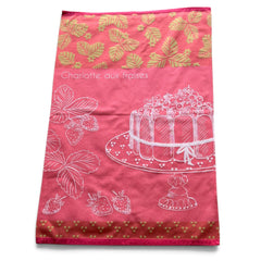 Pink French tea towel with golden strawberry leaves and a white illustration of a Charlotte aux Fraises dessert on a cake stand, by Coucke.