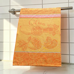 Yellow and orange French tea towel with woven lemon and citrus slice motifs and decorative borders, by Coucke.